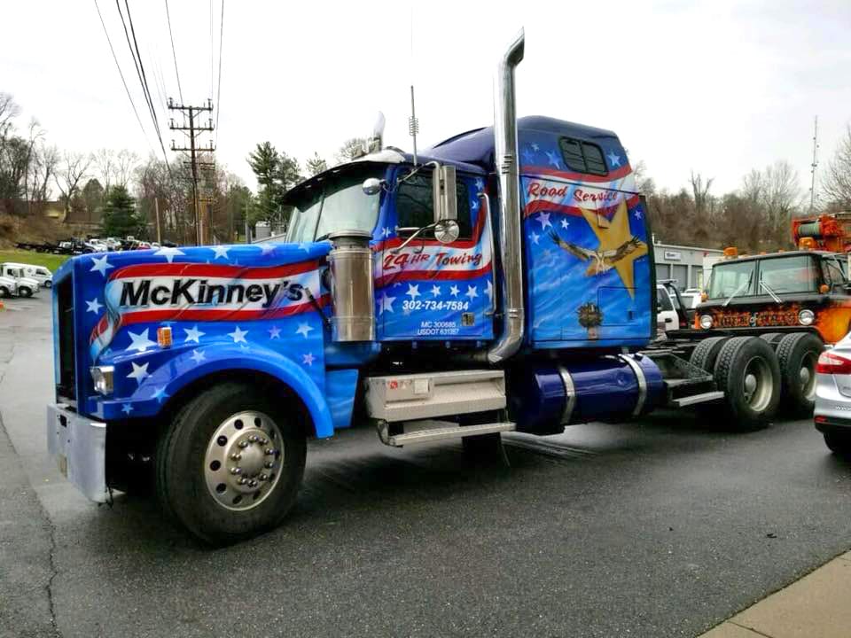 Vehicle Jumpstart Services in Bowers 1 McKinney's Towing & Road Service blue company tow truck